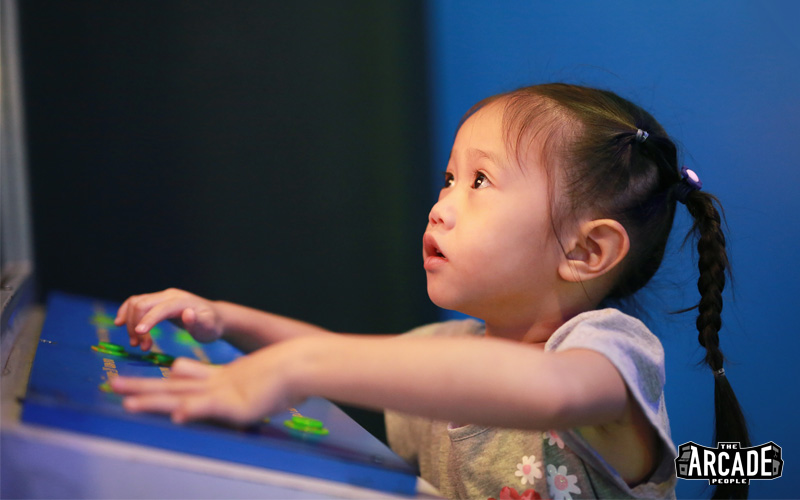 little girl playing some carnival games in singapore